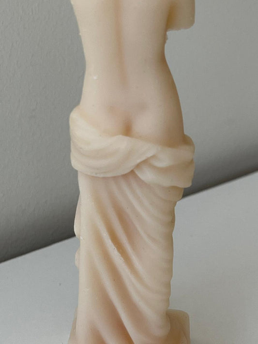 Statue of virgo candle