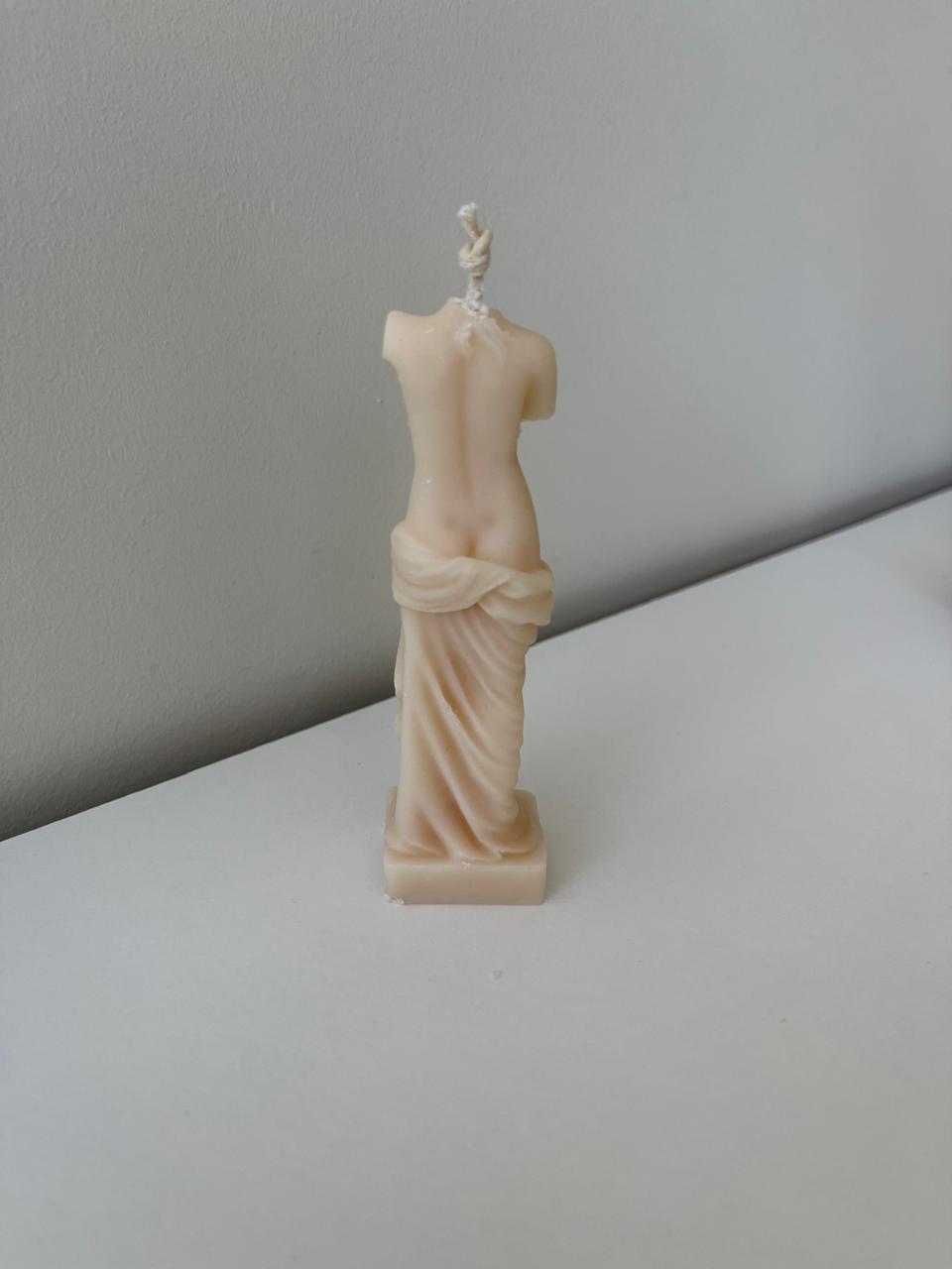 Statue of virgo candle