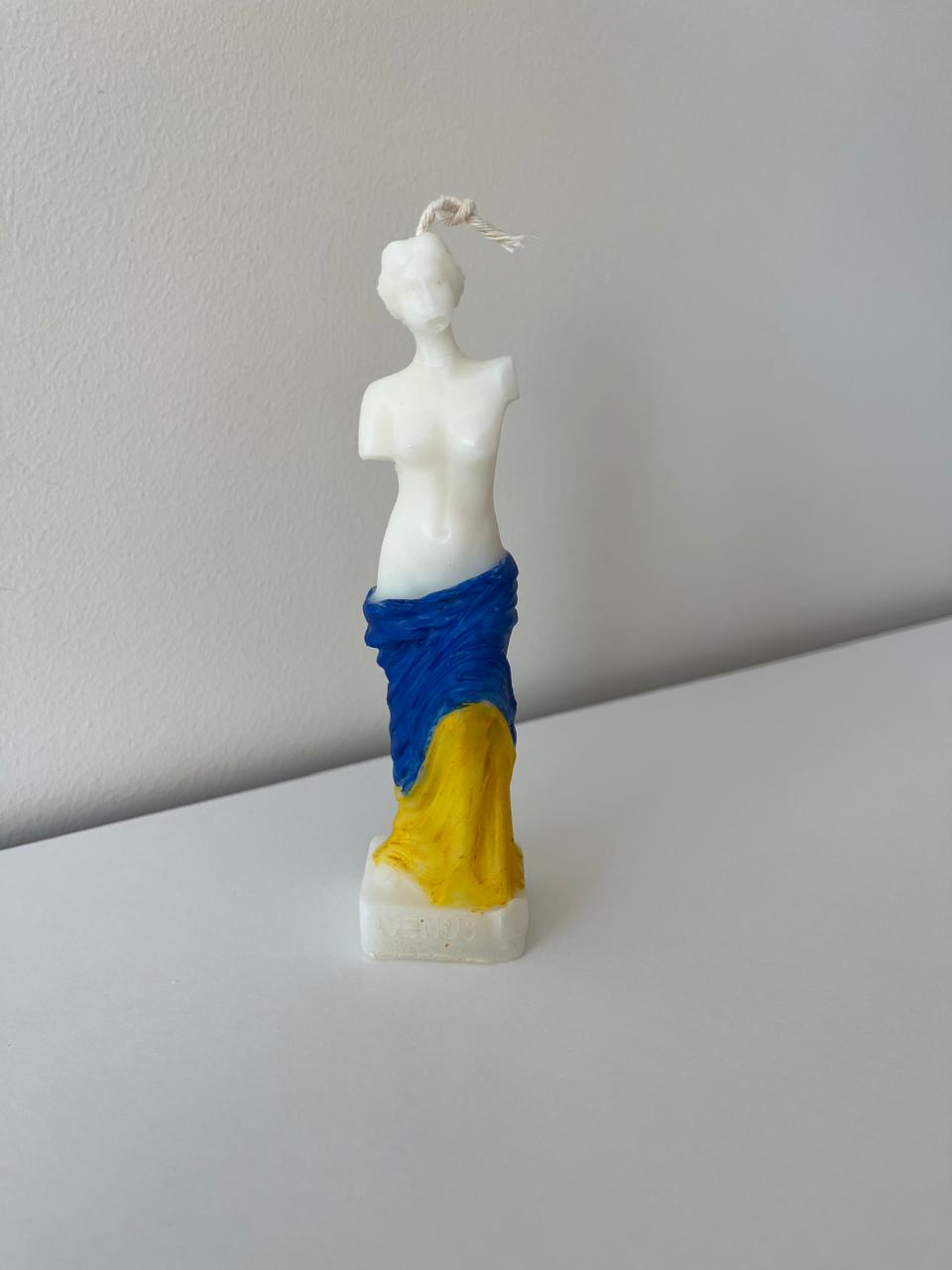 Statue of virgo candle
